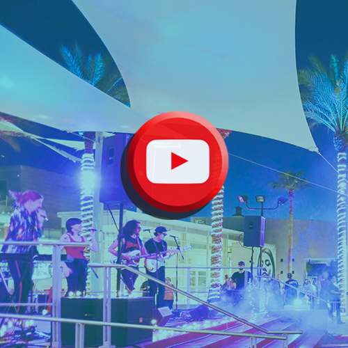Band on stage with YouTube logo
