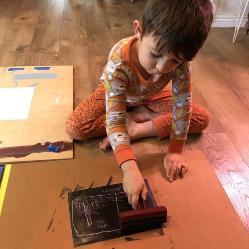 Child doing ink printing activity 