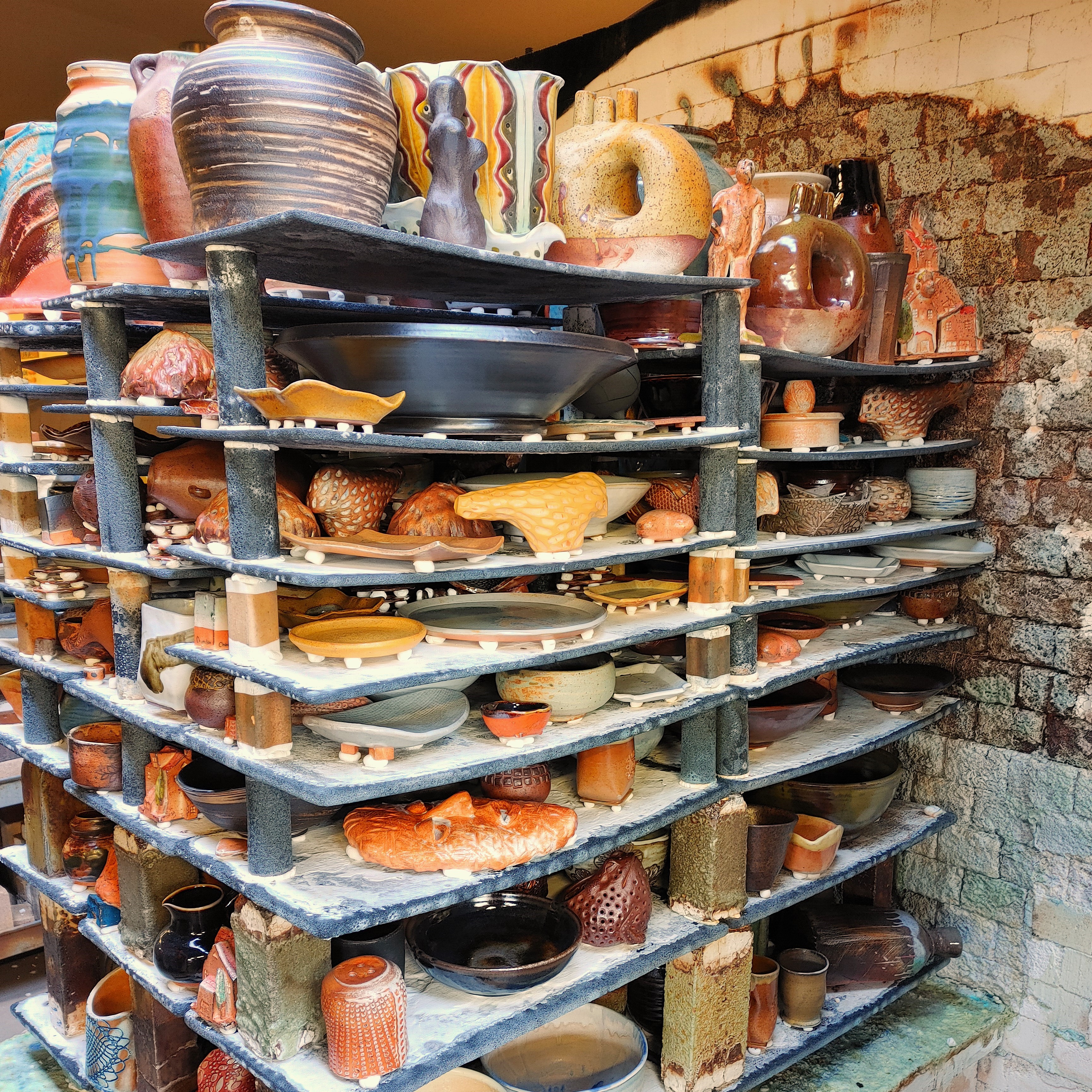 Range of Pottery Molds on a Wooden Shelf in Potters Studio. for